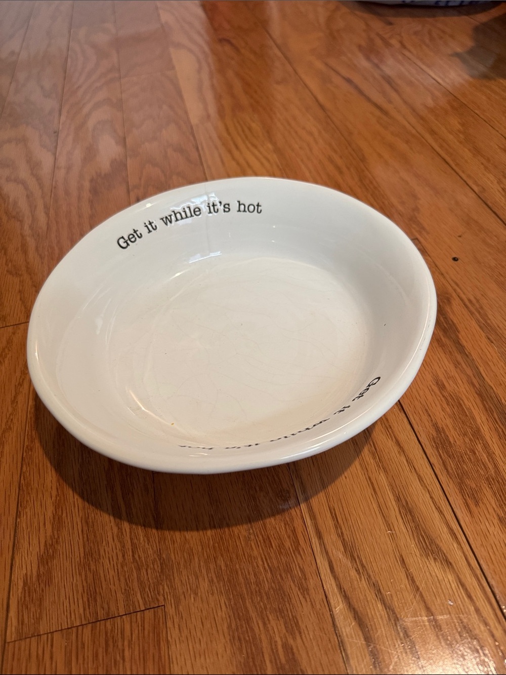 White Ceramic Bowl with 'Get it while it's hot' Text